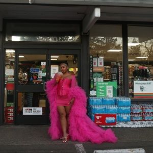 Pink tulle robe with ruffles.